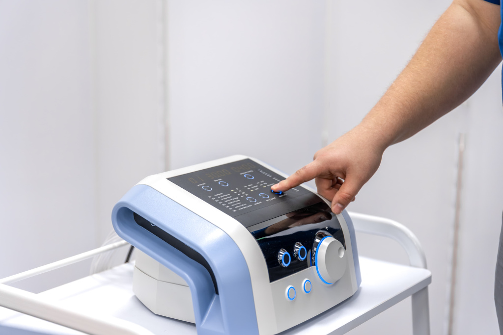 doctor-hand-presses-pressotherapy-device-control-panel-medical-technology (1).jpg